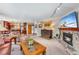 Spacious living area with an open floor plan and a stone fireplace at 290 Broken Lance Dr # B202, Breckenridge, CO 80424
