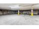 Spacious parking garage with painted supports and adequate lighting at 290 Broken Lance Dr # B202, Breckenridge, CO 80424