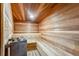 Wooden sauna with rock heater and wooden benches for comfortable relaxation at 290 Broken Lance Dr # B202, Breckenridge, CO 80424