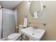 Bathroom featuring a modern sink, sleek faucet, and walk-in shower at 4901 Ashbrook Cir, Highlands Ranch, CO 80130