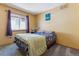 Cozy bedroom with a window for natural light and neutral walls at 4901 Ashbrook Cir, Highlands Ranch, CO 80130