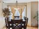 Cozy dining area featuring hardwood floors, a wooden dining table with chairs, and natural light at 4901 Ashbrook Cir, Highlands Ranch, CO 80130