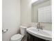 Clean half bath includes modern vanity, fixtures, and finishes for an updated look at 10309 W Fair Ave # E, Littleton, CO 80127