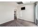 Bedroom features ensuite bath and television, combining comfort and functionality in a cozy space at 10309 W Fair Ave # E, Littleton, CO 80127
