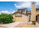 Inviting home exterior showing a charming two-story design, garage, and well-maintained landscaping at 10309 W Fair Ave # E, Littleton, CO 80127