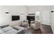 Cozy living room featuring modern decor, a fireplace, and natural light at 10309 W Fair Ave # E, Littleton, CO 80127
