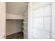 Walk-in pantry features adjustable metal shelving for optimal storage and organization capabilities at 10309 W Fair Ave # E, Littleton, CO 80127