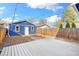 Cozy backyard featuring a wooden deck, blue garage and string lights, perfect for outdoor entertaining at 3429 W 34Th Ave, Denver, CO 80211