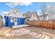 Beautiful backyard with a stone path, wooden fence, and deck, blending natural elements with the house's style at 3429 W 34Th Ave, Denver, CO 80211