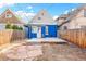 A backyard with a light-colored deck that complements the house paint; string lights add a cozy atmosphere at 3429 W 34Th Ave, Denver, CO 80211