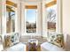 Cozy bay window nook featuring comfortable seating and lots of natural light at 3429 W 34Th Ave, Denver, CO 80211