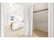 View of bedroom with white walls, sloped ceilings, and adjoining closet at 3429 W 34Th Ave, Denver, CO 80211