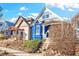 Charming home exterior featuring blue siding and stairs leading up to the welcoming front porch at 3429 W 34Th Ave, Denver, CO 80211