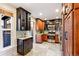 Modern kitchen with stainless steel appliances, two-tone cabinetry, and tile floors at 3429 W 34Th Ave, Denver, CO 80211