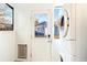 A laundry room with washer and dryer, cat door, and view of exterior at 3429 W 34Th Ave, Denver, CO 80211