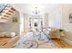 Cozy living room featuring a large area rug, bay windows, and comfortable seating at 3429 W 34Th Ave, Denver, CO 80211