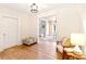 Charming living room featuring hardwood floors and an open doorway leading to additional living spaces at 3429 W 34Th Ave, Denver, CO 80211