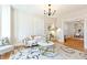 Inviting living room with hardwood floors, a cozy couch, and an elegant chandelier at 3429 W 34Th Ave, Denver, CO 80211