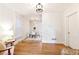 Bright living room flows into the dining area, featuring hardwood floors and neutral paint at 3429 W 34Th Ave, Denver, CO 80211