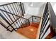 View of staircase featuring hardwood steps and decorative black metal railing at 3429 W 34Th Ave, Denver, CO 80211