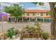 A street view highlighting local cafes and shops along a tree-lined street, promoting a walkable lifestyle at 3429 W 34Th Ave, Denver, CO 80211