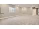 Spacious unfinished basement with carpeted floor at 6917 Kendrick Ln, Arvada, CO 80007