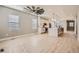 Bright living room with hardwood floors and a ceiling fan at 6917 Kendrick Ln, Arvada, CO 80007