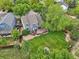 Aerial view showcases the home's private backyard, wooden deck, mature trees, and lush landscaping at 6726 W 97Th Cir, Westminster, CO 80021