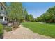 Spacious backyard featuring a deck, lush lawn, mature trees, and peaceful setting with a hammock at 6726 W 97Th Cir, Westminster, CO 80021