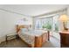 Bright bedroom featuring a wood frame bed, bay windows, and a decorative floral border along the ceiling at 6726 W 97Th Cir, Westminster, CO 80021