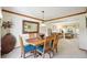 Warm dining room open to the living room showcasing comfortable open-concept living at 6726 W 97Th Cir, Westminster, CO 80021