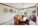 Cozy dining room featuring wood trim, natural light, and a stylish light fixture at 6726 W 97Th Cir, Westminster, CO 80021