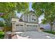 Charming two-story home with a three-car garage framed by mature, shady trees at 6726 W 97Th Cir, Westminster, CO 80021