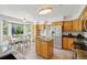 Spacious kitchen with stainless steel fridge, granite counters, and bright breakfast nook at 6726 W 97Th Cir, Westminster, CO 80021
