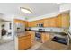 Well-lit kitchen featuring stainless steel appliances, granite countertops, and an island at 6726 W 97Th Cir, Westminster, CO 80021