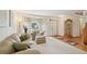 Inviting living room with plush seating, large window, and a classic grandfather clock at 6726 W 97Th Cir, Westminster, CO 80021