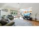 Inviting living room with vaulted ceilings open to dining area and access to the backyard at 6726 W 97Th Cir, Westminster, CO 80021