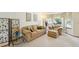 Bright living room with comfortable seating, natural light, and stylish decor at 6726 W 97Th Cir, Westminster, CO 80021