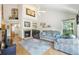 Bright living room featuring a cozy fireplace and vaulted ceilings for spacious comfort at 6726 W 97Th Cir, Westminster, CO 80021