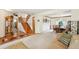 Spacious living area flows into the dining room, featuring a staircase and wood floors at 6726 W 97Th Cir, Westminster, CO 80021