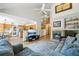 Bright and open living area with hardwood floors, fireplace, and open to kitchen at 6726 W 97Th Cir, Westminster, CO 80021