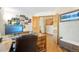 Bright office space with a large desk, natural light, and wooden floors at 6726 W 97Th Cir, Westminster, CO 80021