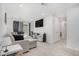 Inviting living room with plush carpeting and a large screen, ideal for relaxing and entertaining at 20932 E 60Th Ave, Aurora, CO 80019