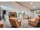 Large finished basement features recessed lights, plush carpet, and comfortable seating at 7693 S Quantock Way, Aurora, CO 80016