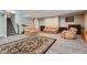 Finished basement featuring a staircase, carpet, and seating with a neutral color scheme at 7693 S Quantock Way, Aurora, CO 80016