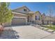Beautiful two-story home featuring a well-maintained lawn and a spacious two-car garage at 7693 S Quantock Way, Aurora, CO 80016