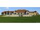 Beautiful exterior view of a well-maintained clubhouse with landscaped grounds at 7693 S Quantock Way, Aurora, CO 80016