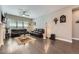 Elegant living room with hardwood floors, comfortable leather sofas, and stylish decor at 7693 S Quantock Way, Aurora, CO 80016