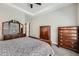 A spacious primary bedroom with tray ceilings, ample storage, and great natural light at 7693 S Quantock Way, Aurora, CO 80016
