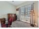 Cozy carpeted office space with natural light from the large windows at 7693 S Quantock Way, Aurora, CO 80016